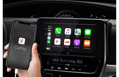Person using Apple CarPlay with aftermarket Kenwood double-din head unit